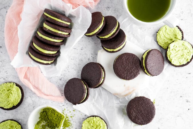 Matcha filled cocoa cookies on neutral background