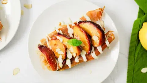 https://www.rodellekitchen.com/wp-content/uploads/2023/07/Peach-and-Prosciutto-Toast-with-Vanilla-Whipped-Ricotta-Spread-hero-480x270.webp