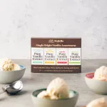 No churn Vanilla Ice cream scooped into colorful bowls. In the central part of the image is Rodelle's Single Origin Gift Pack.