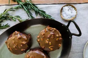 pecan sticky toffee puddings portioned on tray and plate