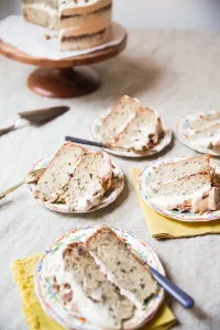 brown butter banana cake by Anne Byrn on neutral background cut into slices